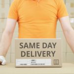 Putting,Carton,With,Same,Day,Delivery,Text,On,The,Table