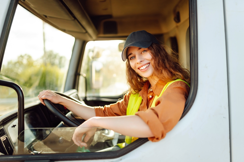 Portrait,Of,Young,Woman,Professional,Driver,Sitting,And,Driving,A